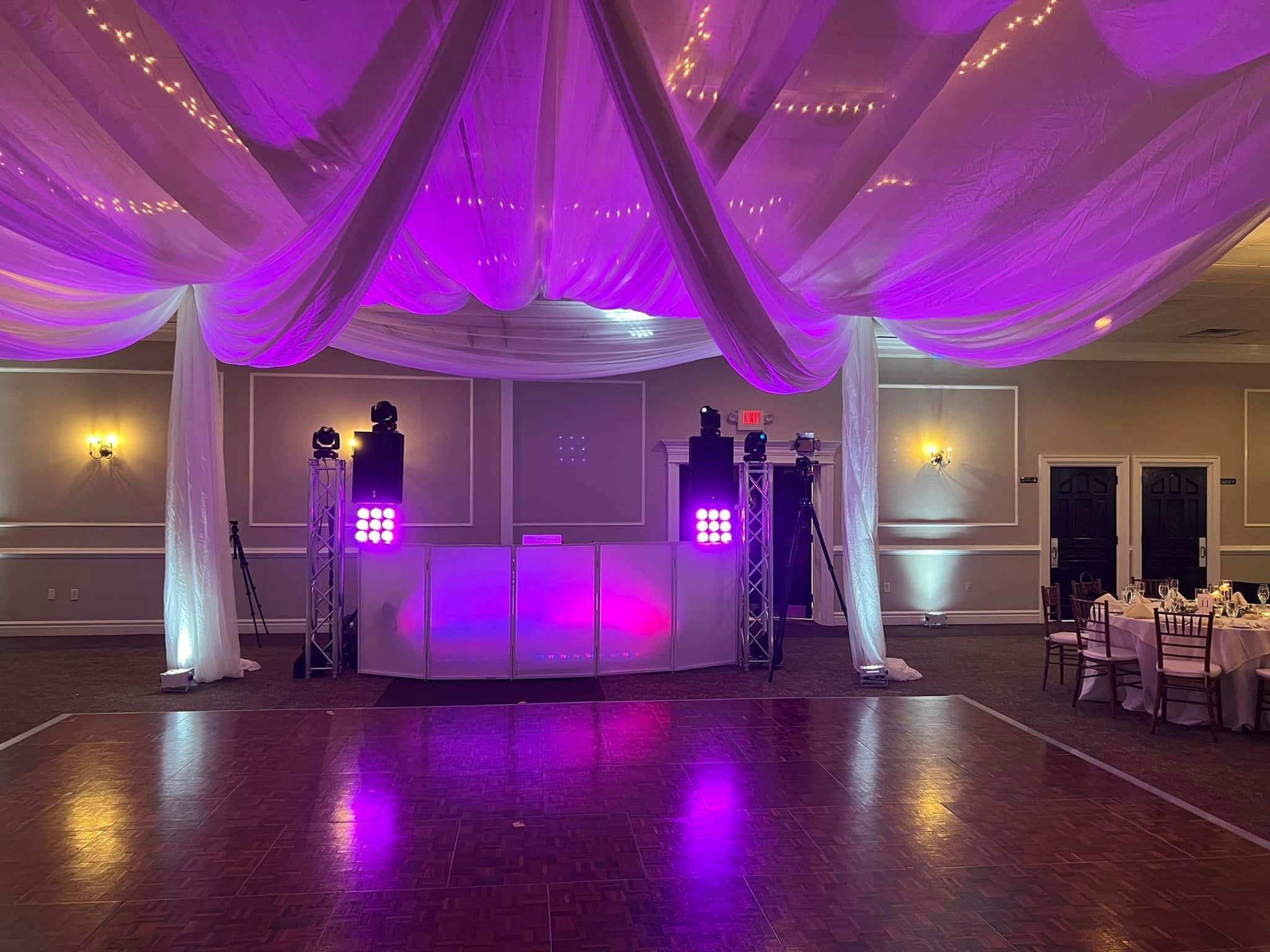 Purple uplighting DJ setup